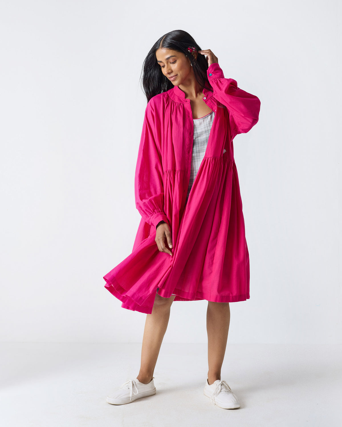 Fuchsia Miya dress worn open over a checked Madras slip.