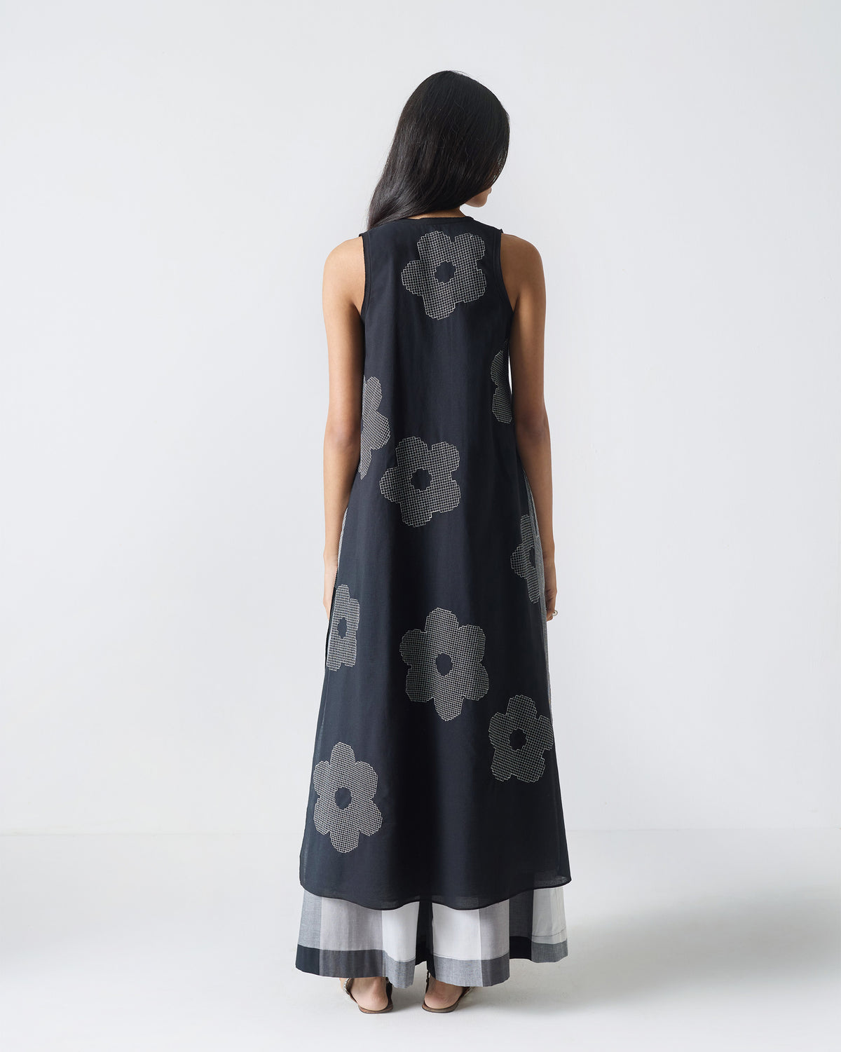 Back of a black Double Layer Kurta with white flower embroidery.