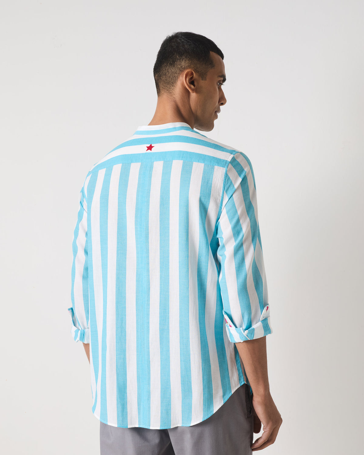 Back of a blue striped Slim Fit Shirt with a red embroidered star.