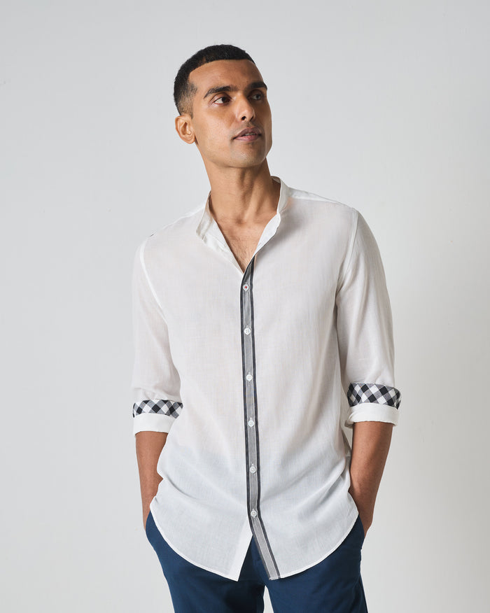 White Neil shirt with striped placket trim and gingham cuff lining.