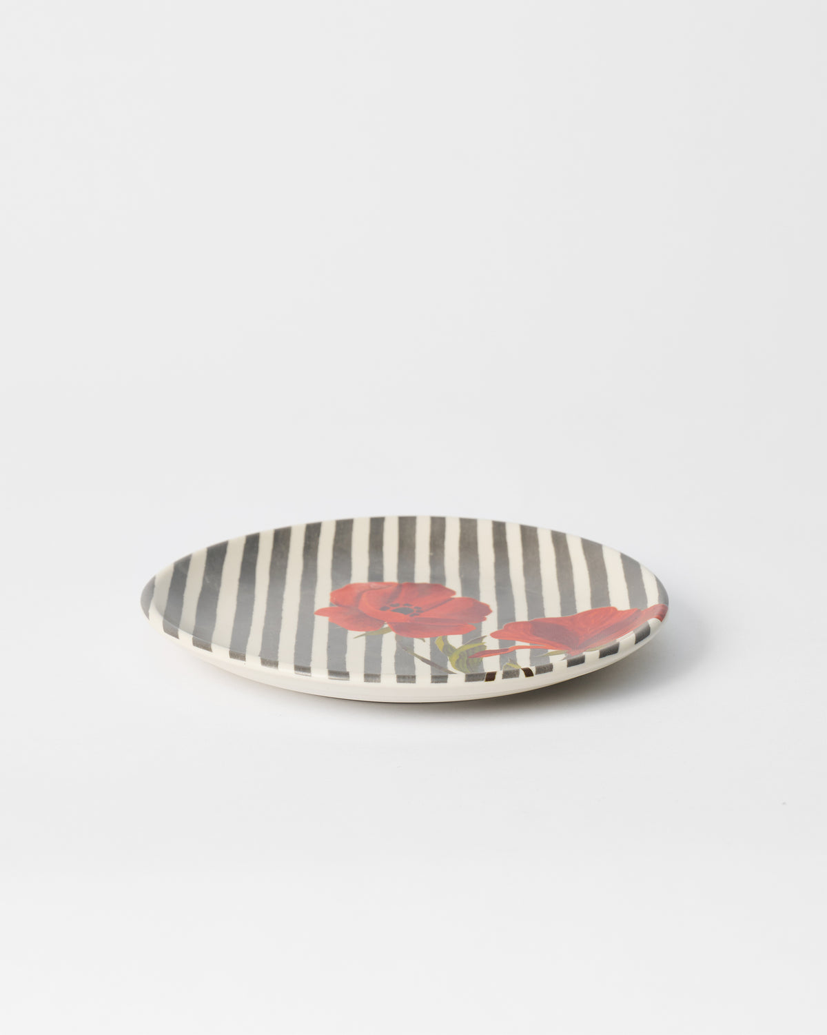 Striped Poppy quarter plate showing its shallow rim and floral print.