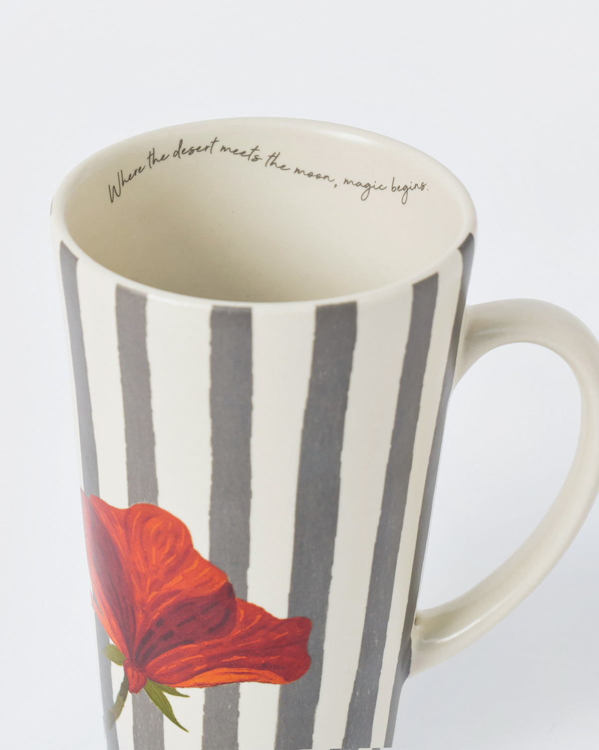 Close-up of Striped Poppy tall mug showing the inner rim quote.