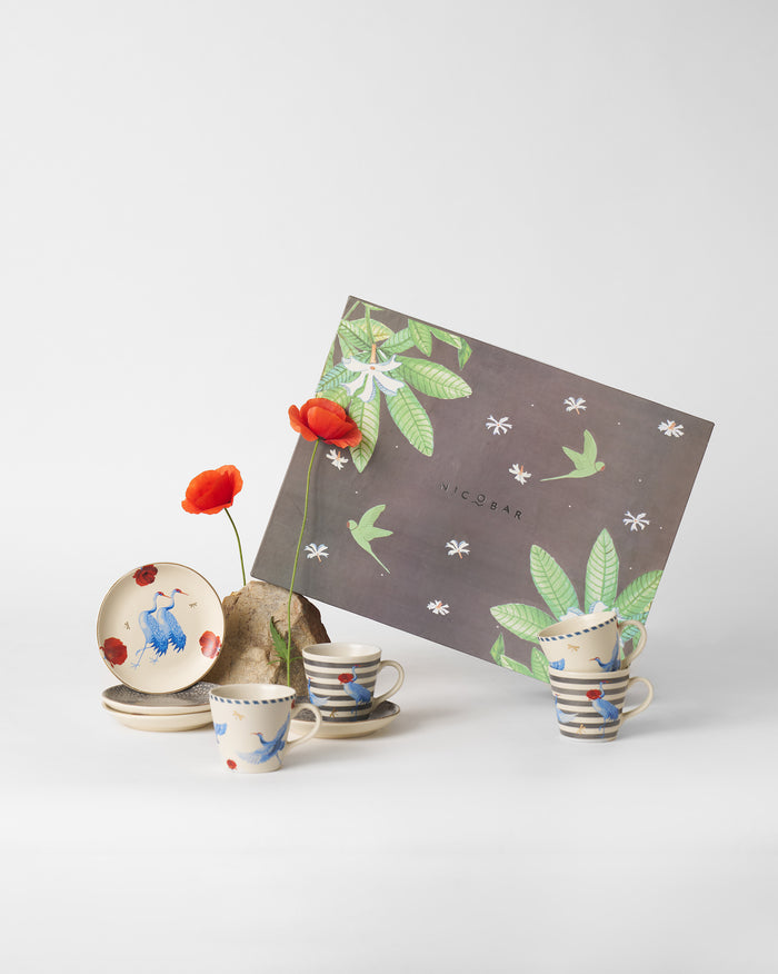 Cups and plates with crane, poppy and stripe motifs