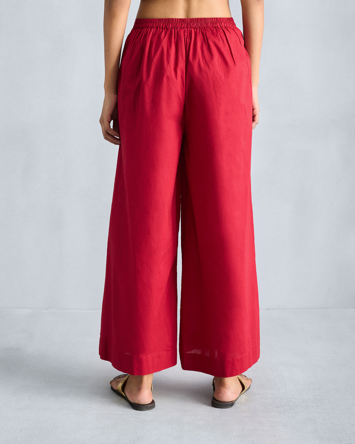 Back of red Basic pyjamas with an elastic gathered waist.