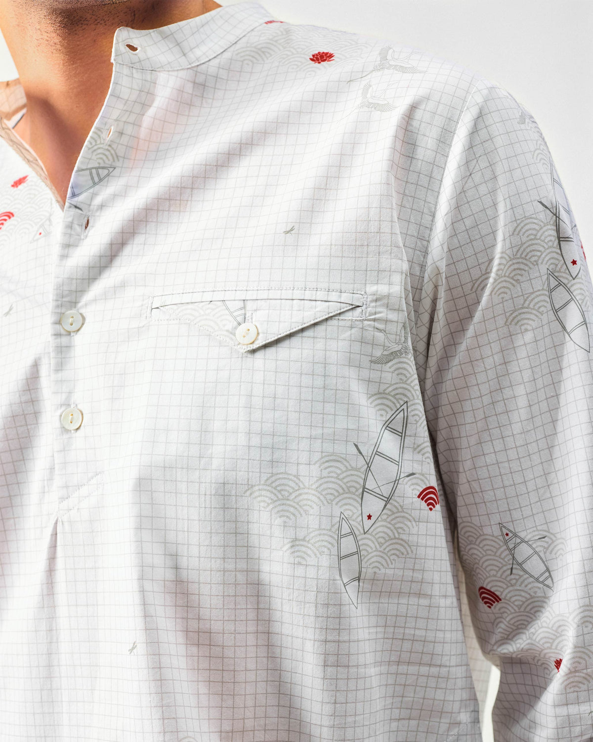 Close-up of boat print and chest pocket on a white Fort kurta.