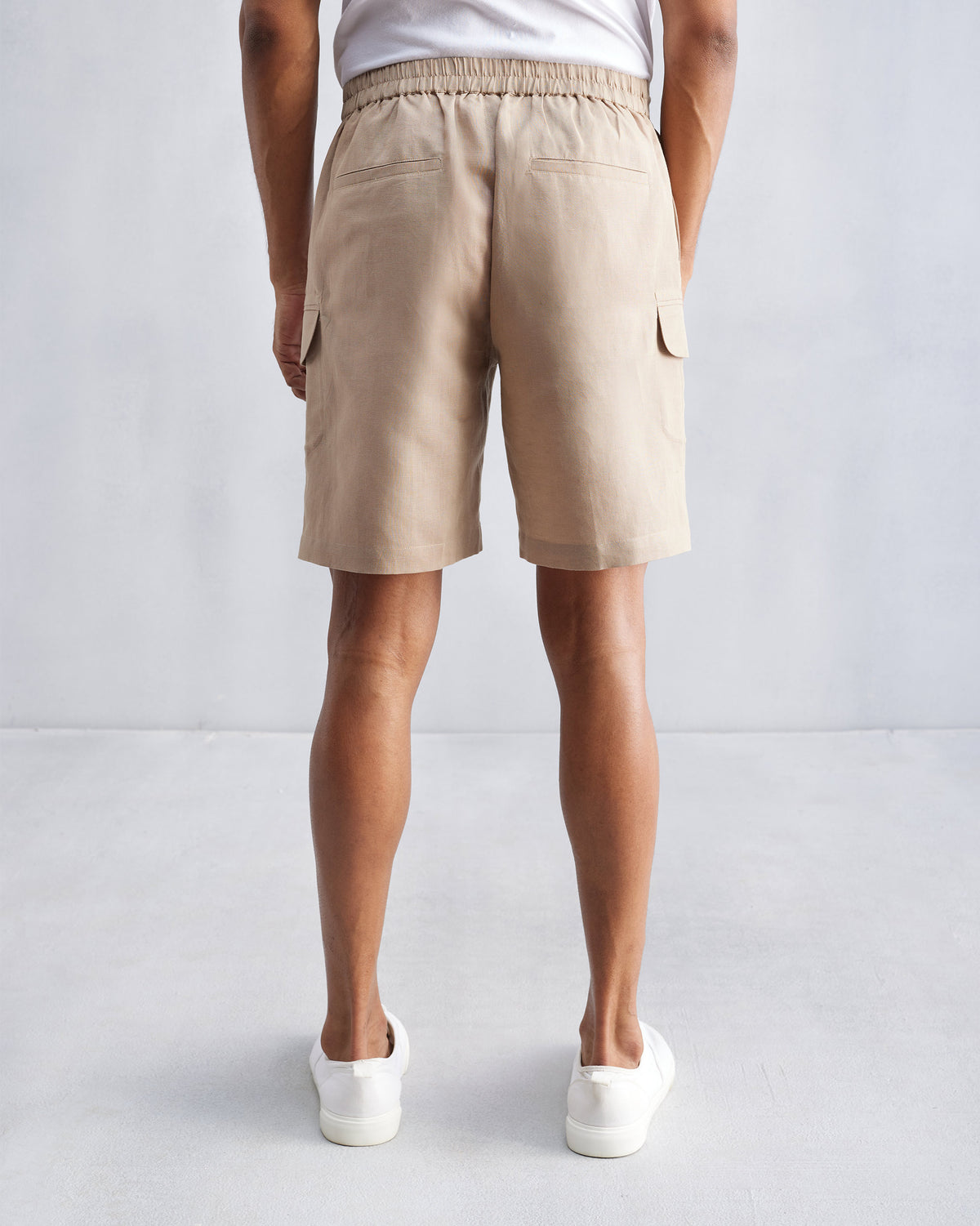 Back of beige Classic Shorts with an elastic waistband.