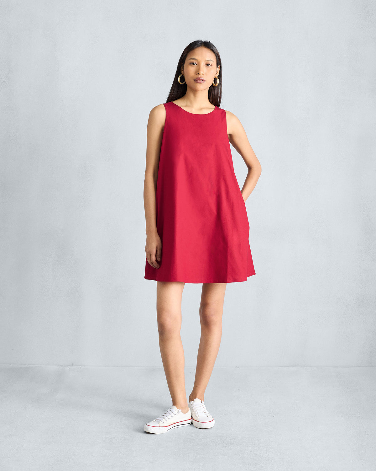 Full-length front view of a red Short Racerback Dress worn by a person.
