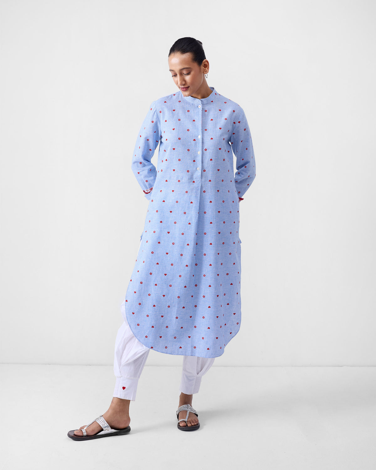 Long blue check kurta with red heart and flower motifs and a mandarin collar.