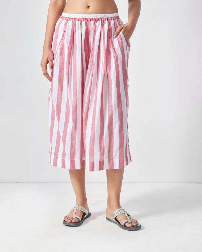 Person wearing red and white striped Aoi Pants with a wide cropped leg.