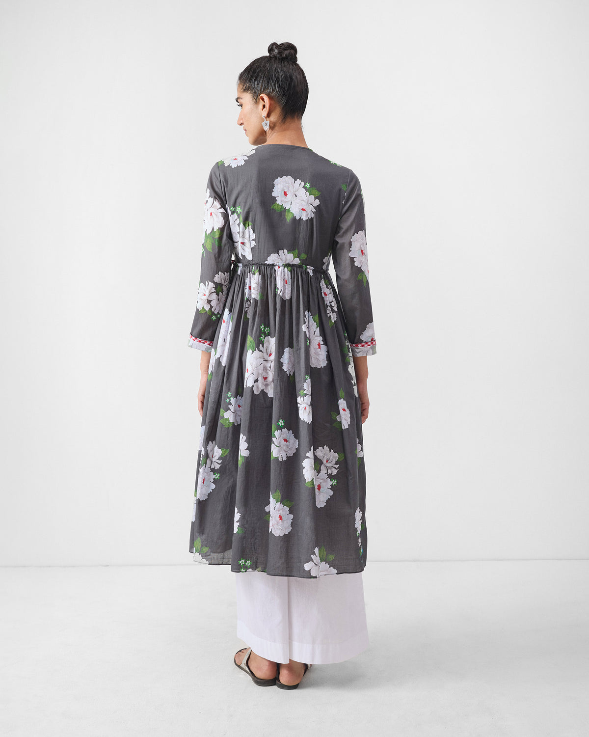 Back of a charcoal angrakha with ivory floral print.