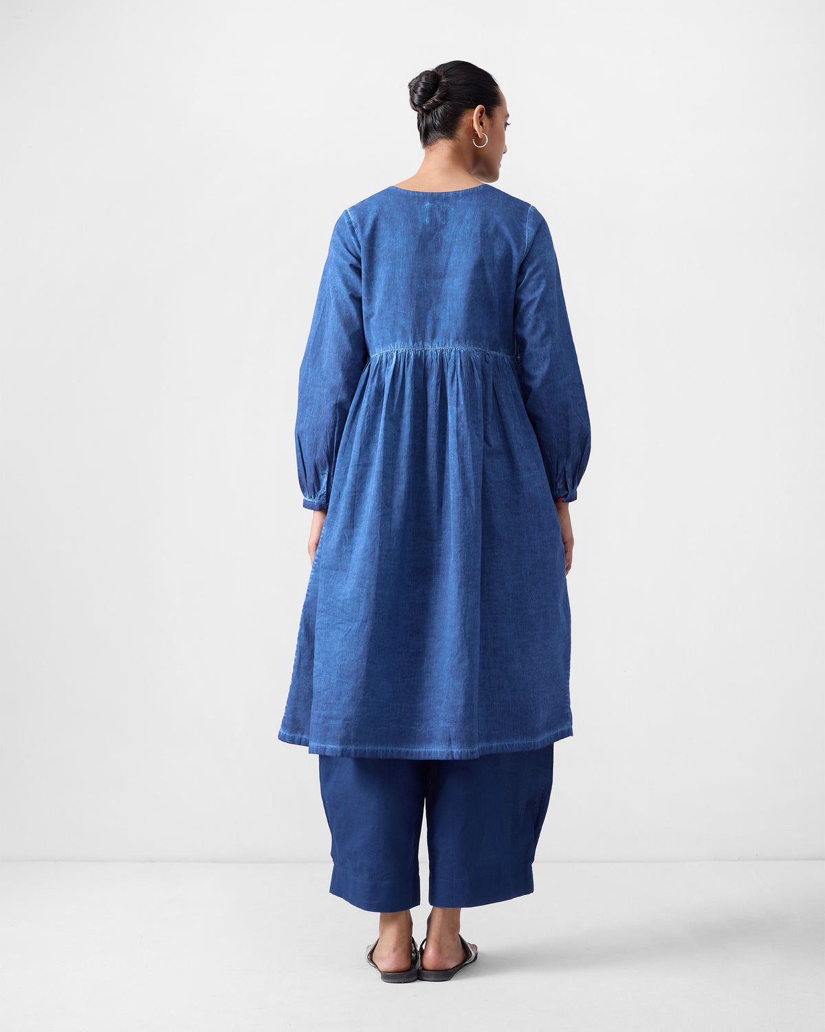 Back of a blue Geisha Kurta with a gathered flare.