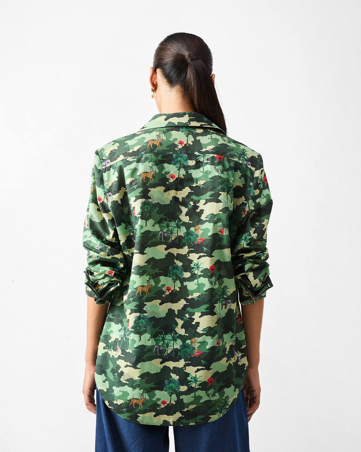 Back of a green camouflage Tropico Shirt with a continuous wildlife print.