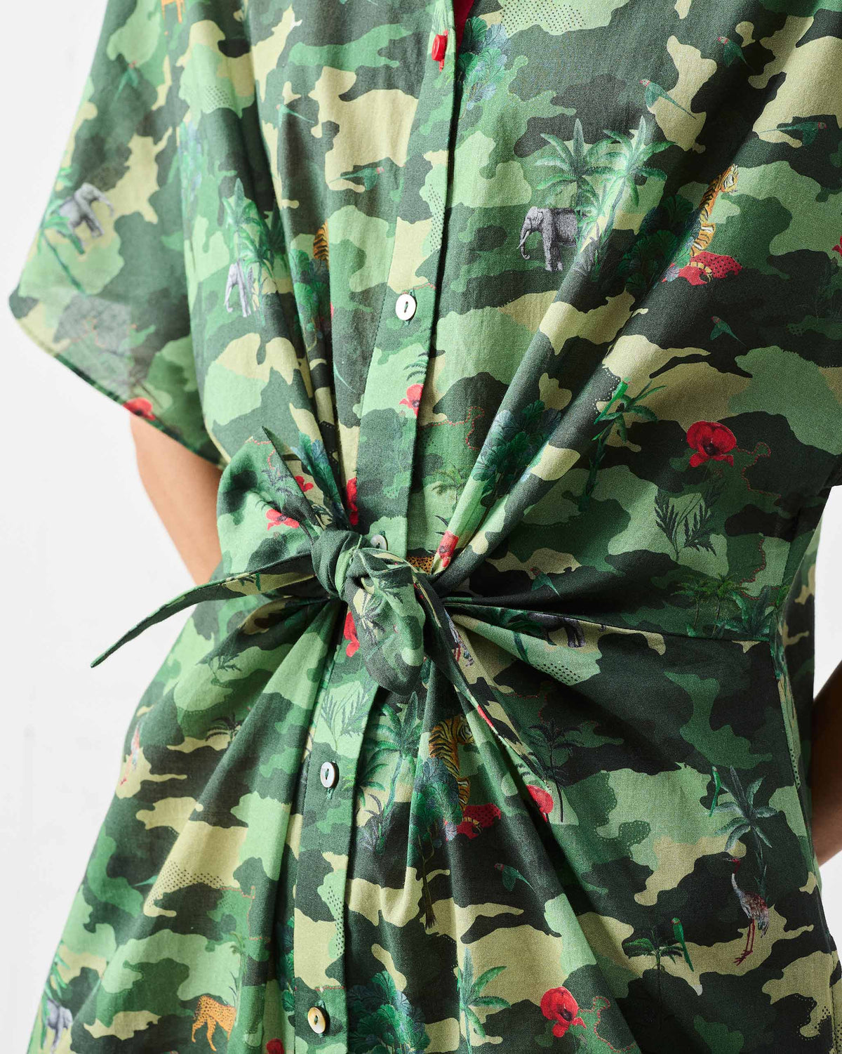 Close-up of the waist knot on a green printed Alappuzha Shirt Dress.