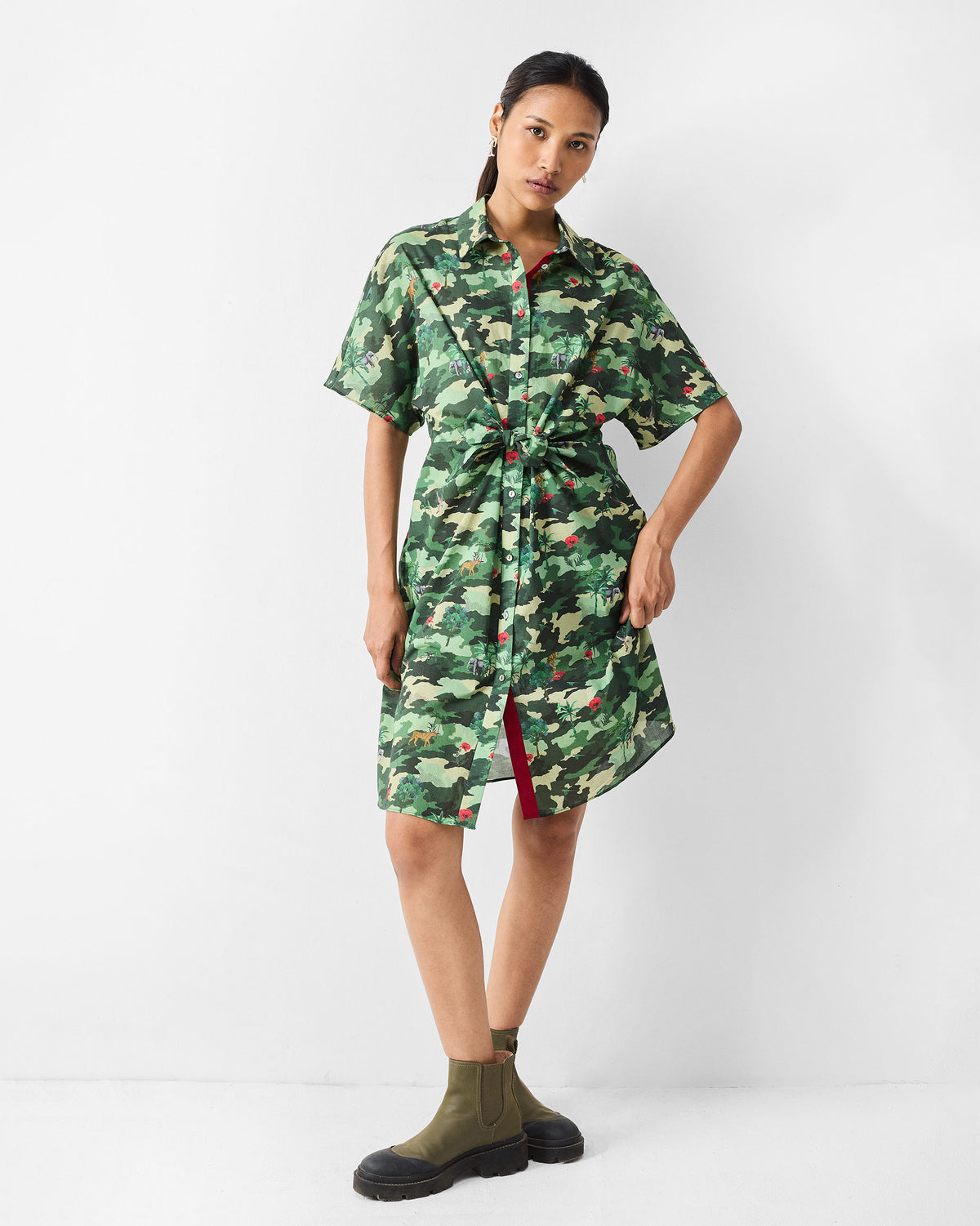 Person wearing a green printed Alappuzha Shirt Dress buttoned at the front.