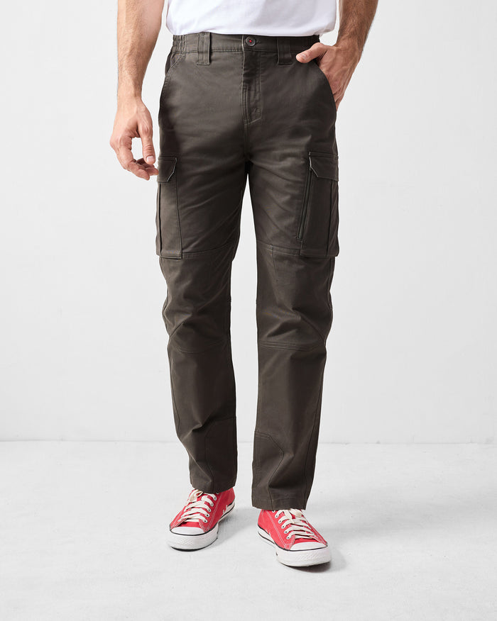 Person wearing deep olive Boscage pants with flap cargo pockets.