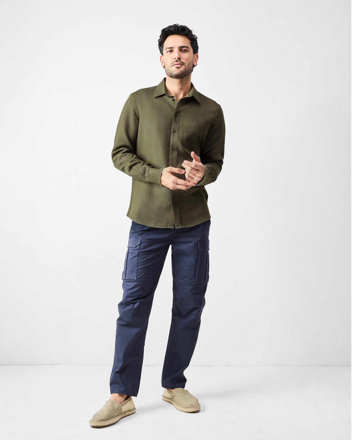 Person wearing navy Boscage cargo pants with thigh pockets.