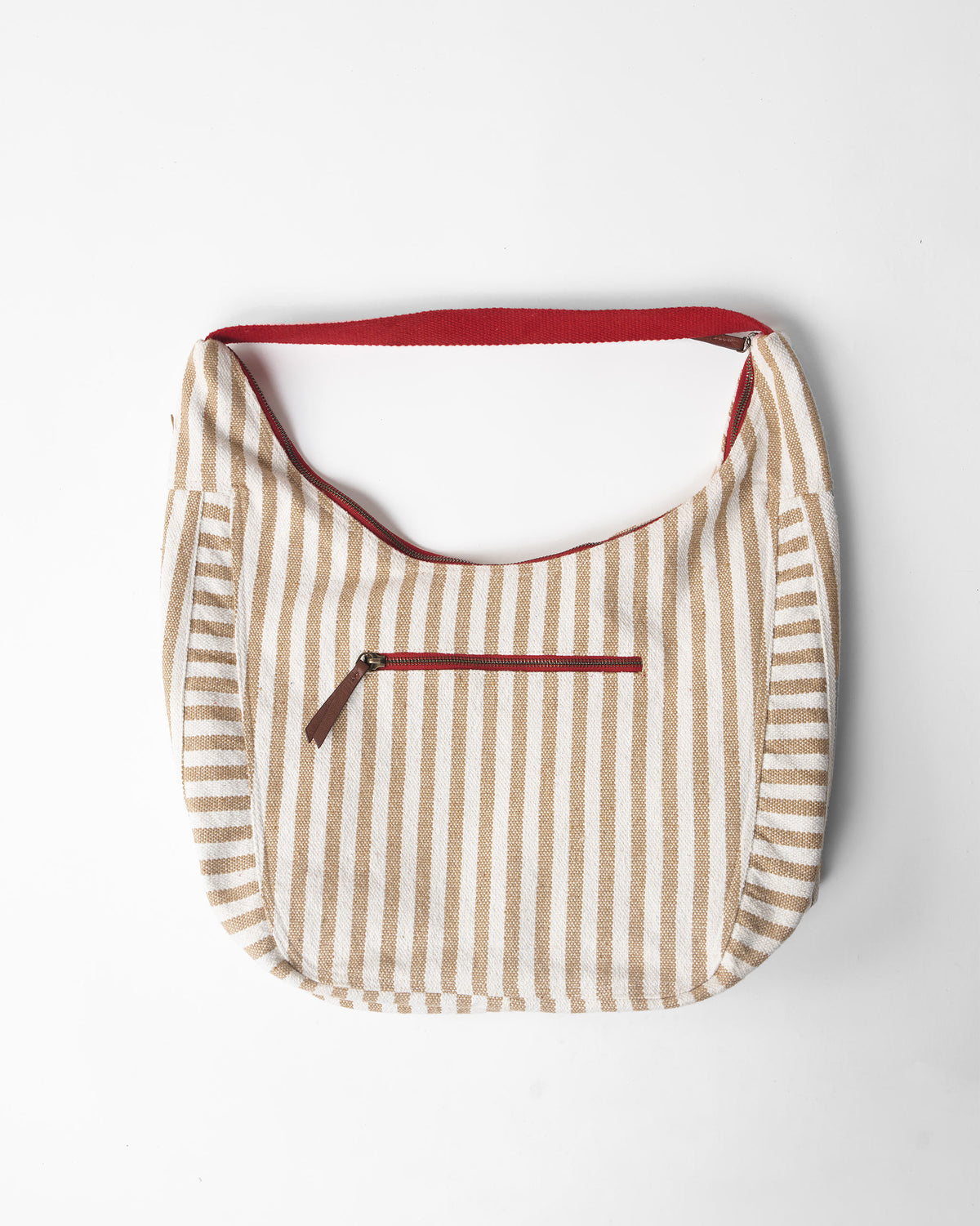 Beige and white striped Wayfarer bag with a red strap.