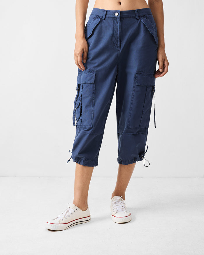 Navy Vellore capris with cargo pockets and drawstring hems.