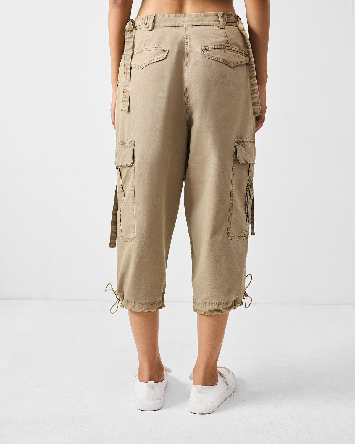 Back of khaki Vellore Capris with flap pockets and drawstring hems.