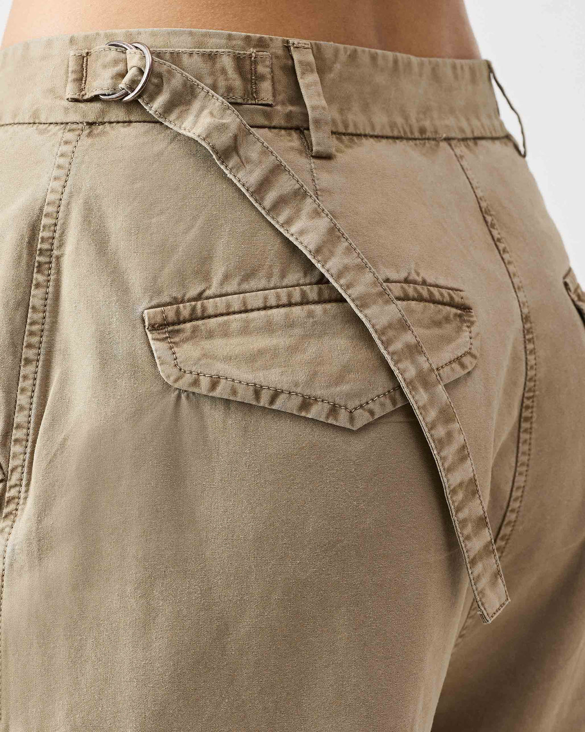 Close-up of the D-ring waist strap on khaki Vellore Capris.