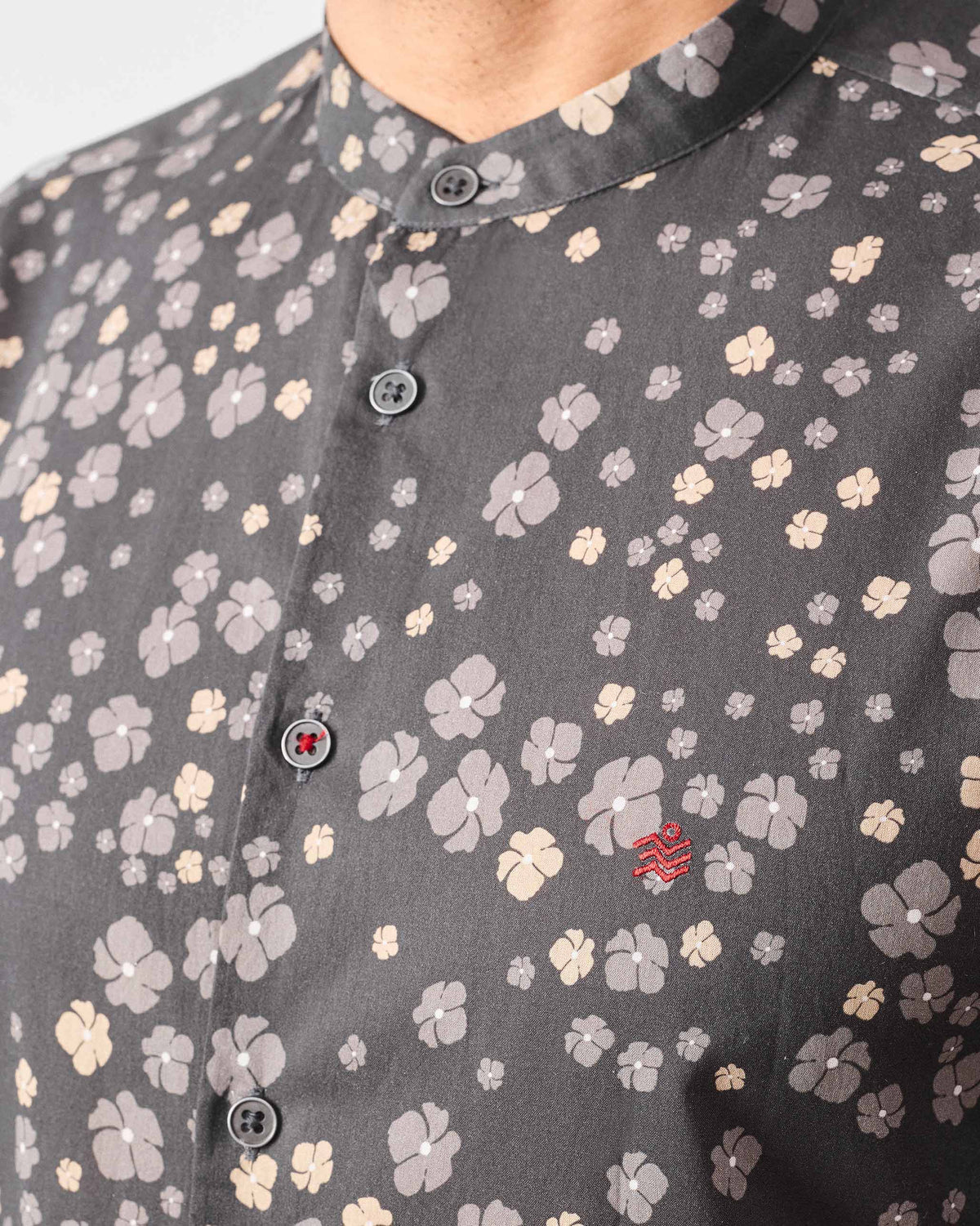 Close-up of a charcoal Nawab Shirt showing a Nehru collar and ditsy floral print.