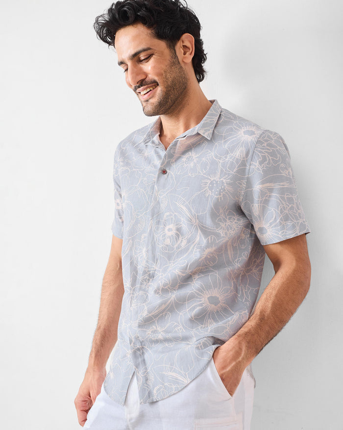 Grey Riverline shirt with a white line-art floral print.