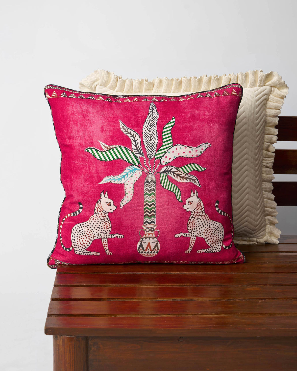 Leopard Palm cushion cover with two leopards flanking a palm tree.