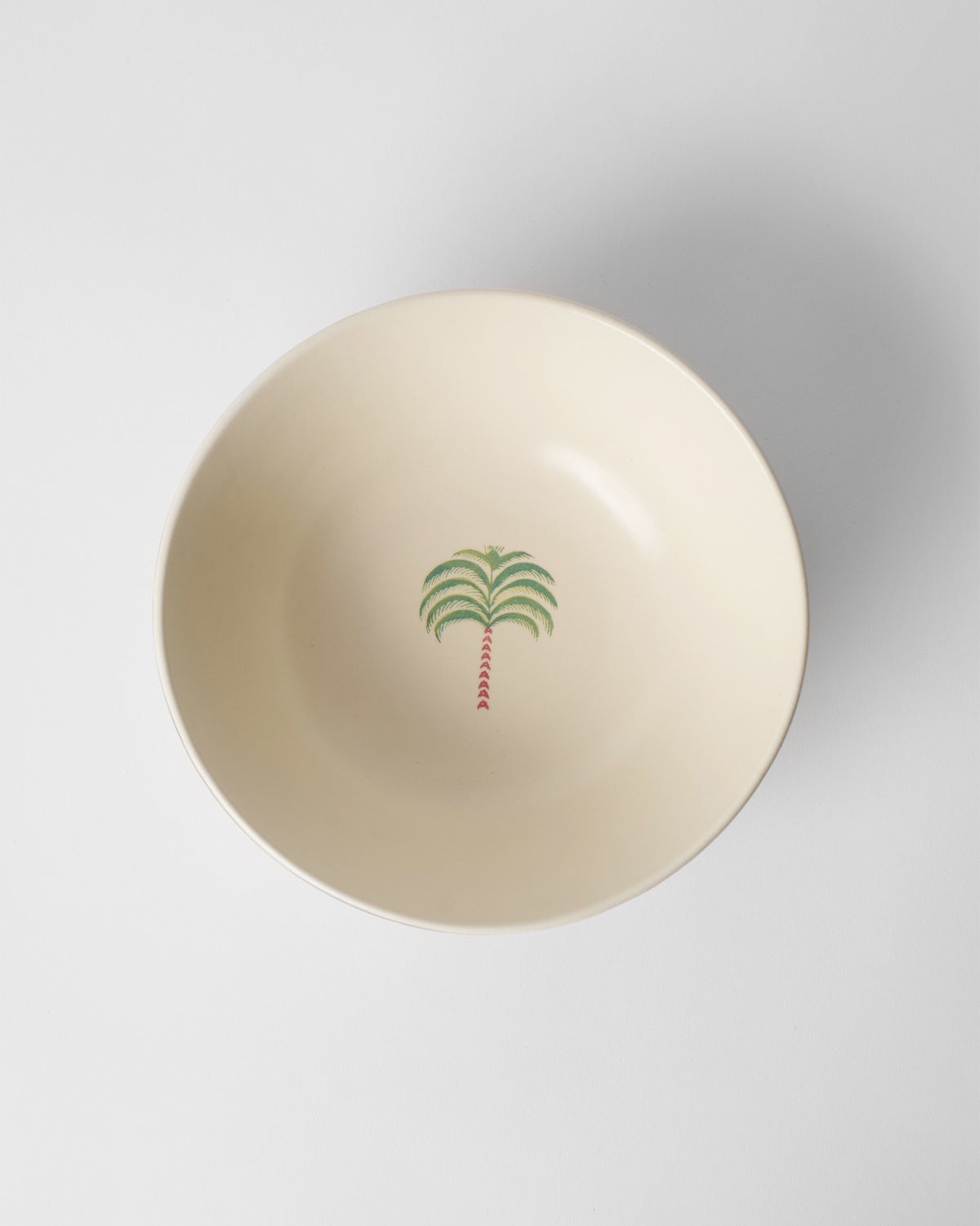 Inside of the Indus Curry Bowl showing a small green palm motif.