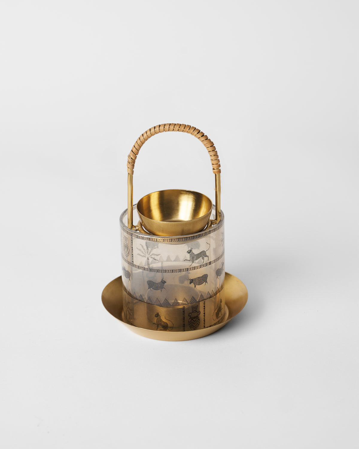 Indus diffuser in brass and glass with palm and animal print bands.