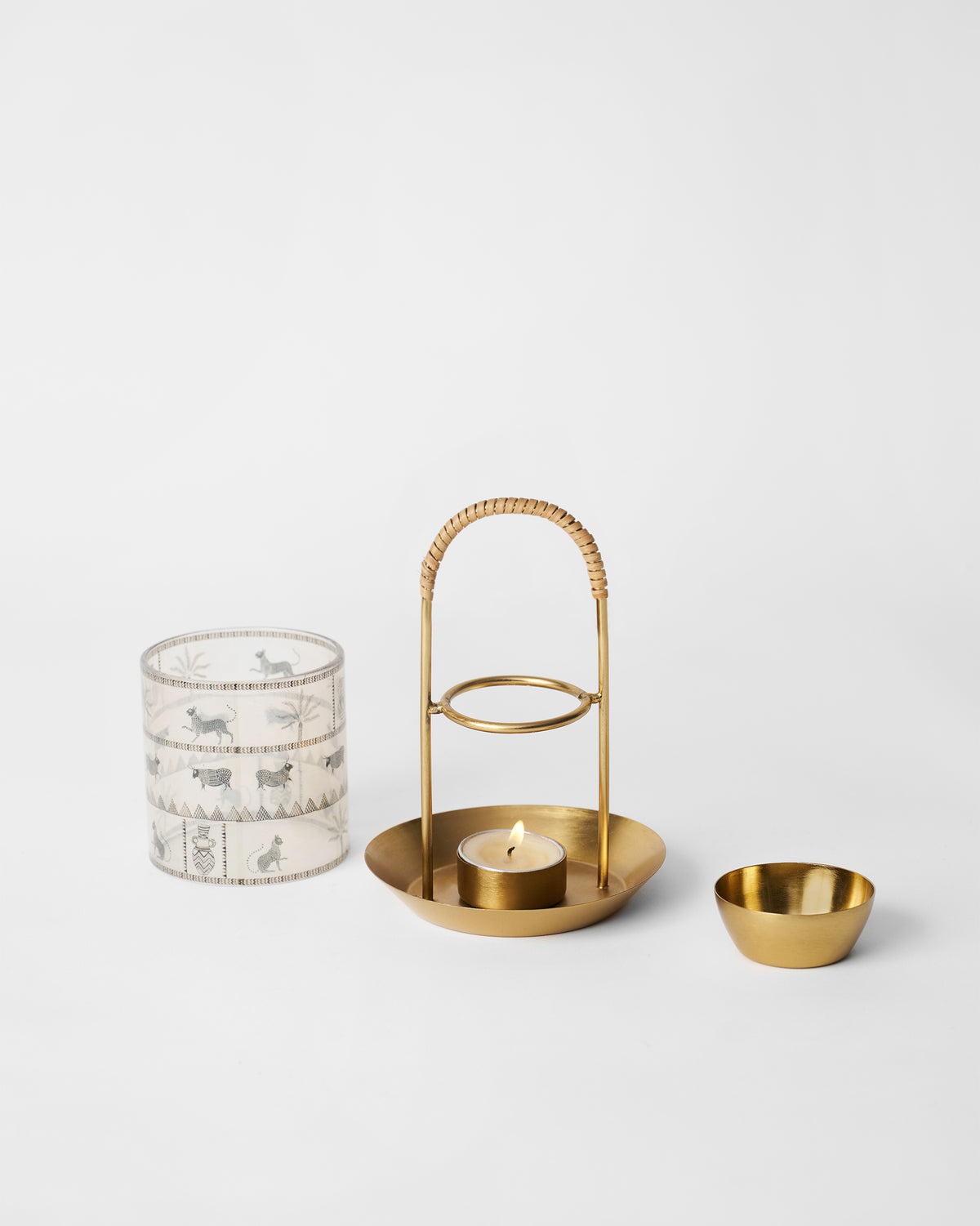 Indus diffuser parts: motif glass sleeve, brass stand, and oil bowl.