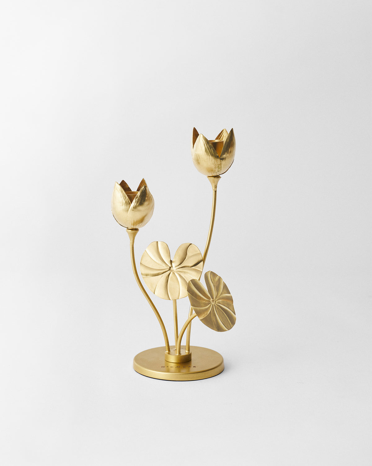 Island Lotus candle holder with gold lotus buds and lily pads.