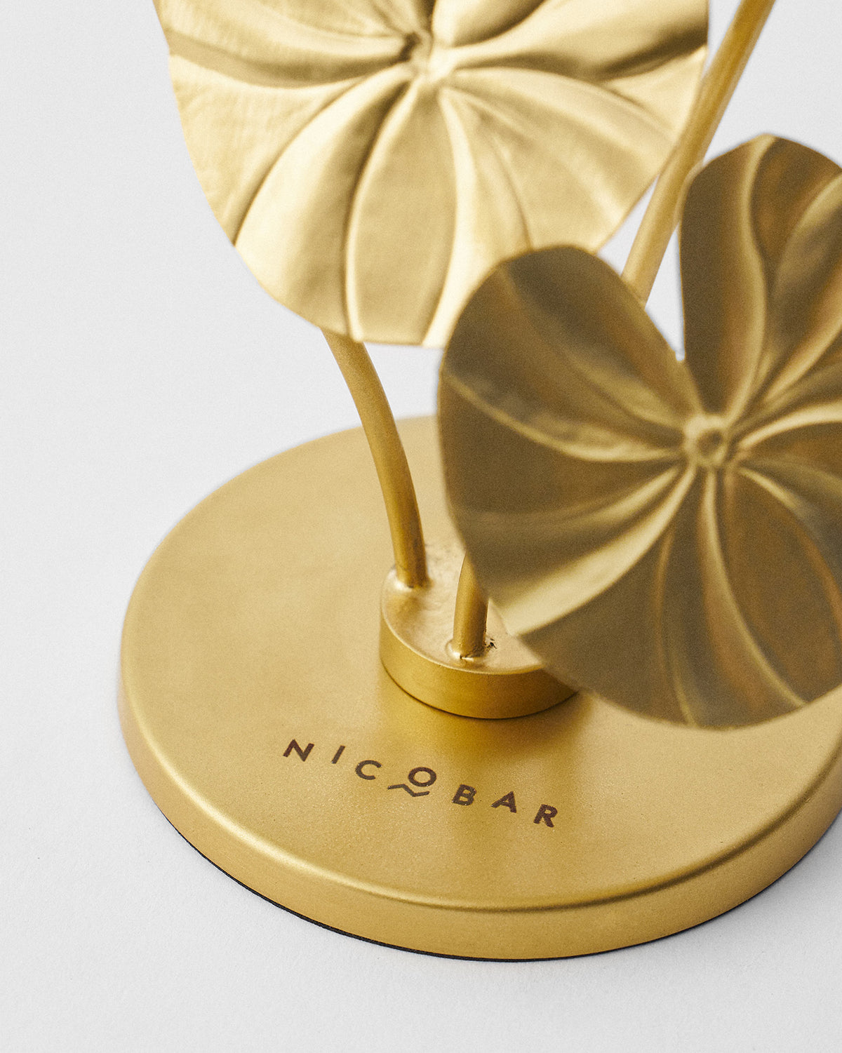 Close-up of Island Lotus candle holder base with veined lily pads.