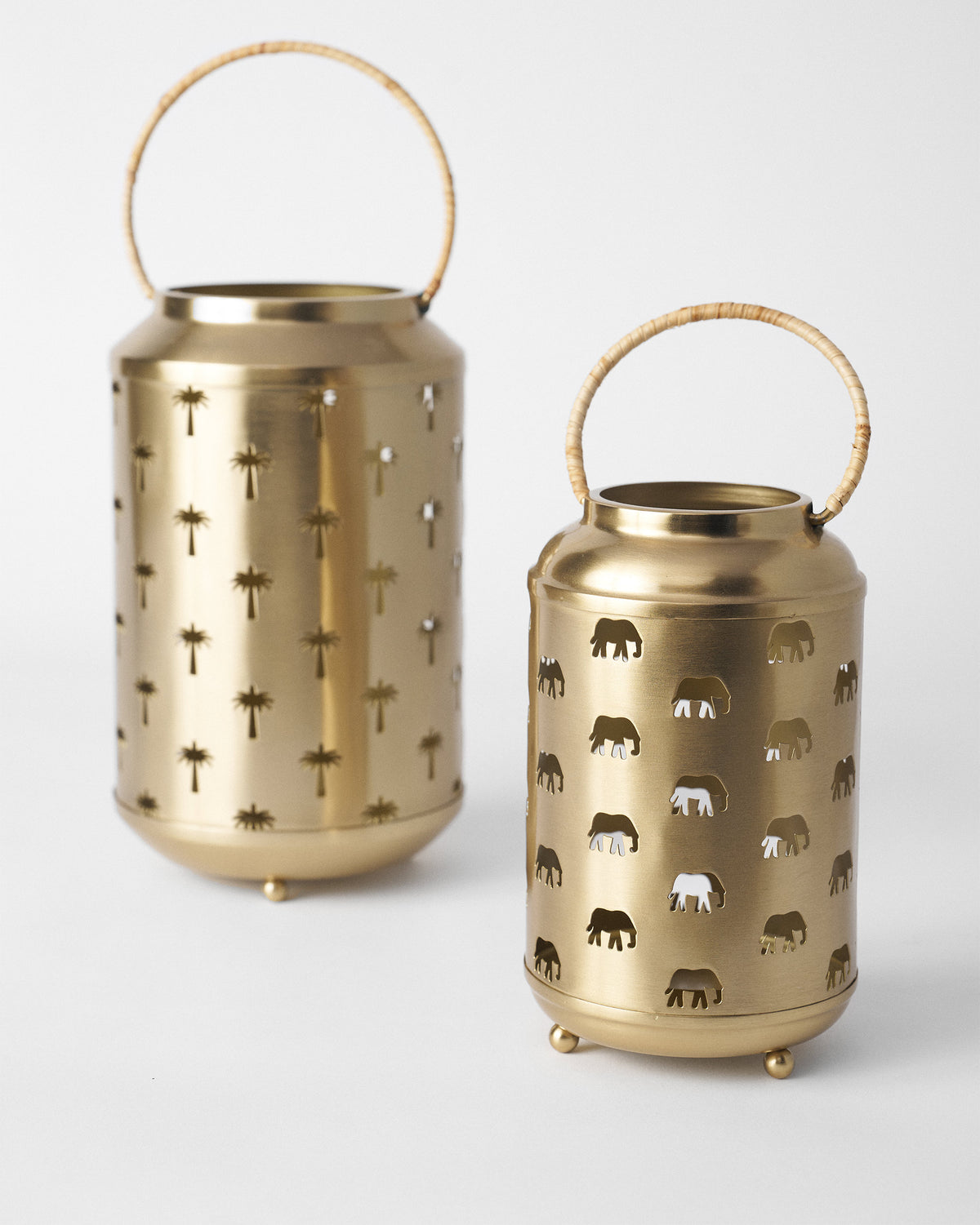 Two gold Ele Palm lanterns: palm cutouts and elephant cutouts.