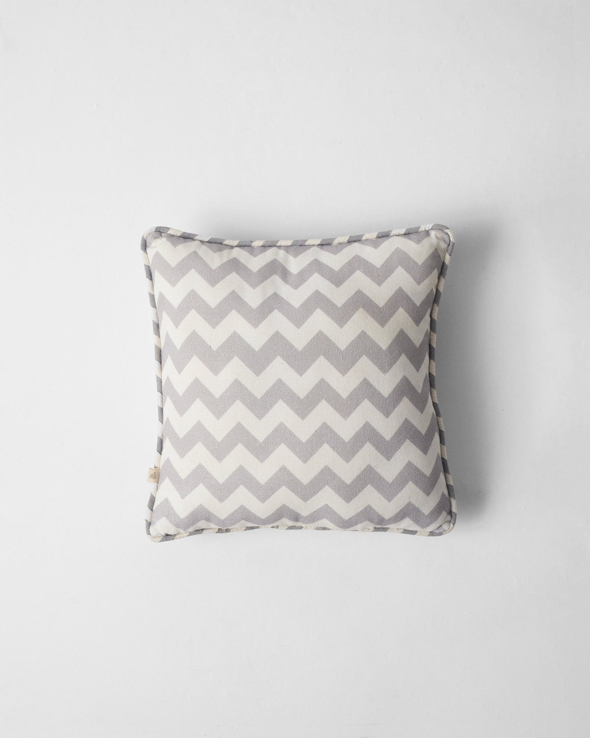 Chevron Lotus Car Cushion with grey and cream chevrons and no flowers.