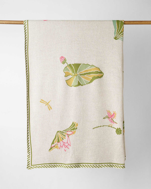 The full throw hanging, its green striped border in view