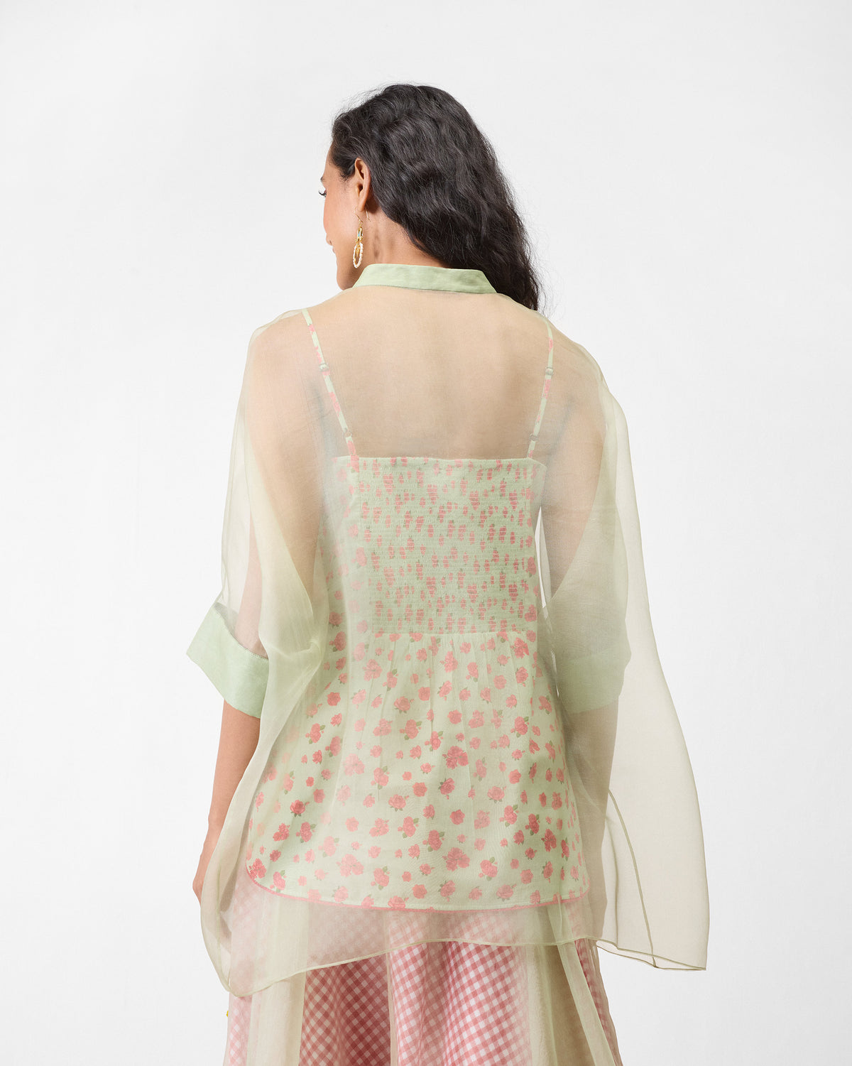 Back of a mint Jaisalmer shirt worn sheer over a floral printed slip.