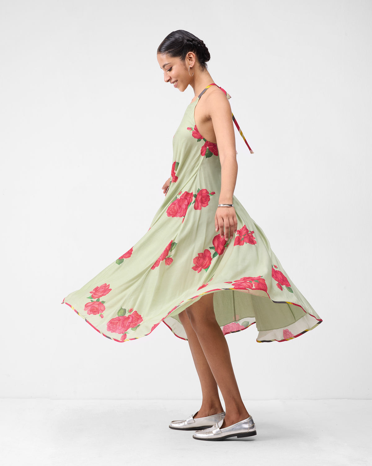 Mint watermelon print scoop back dress with a flared midi skirt in motion.