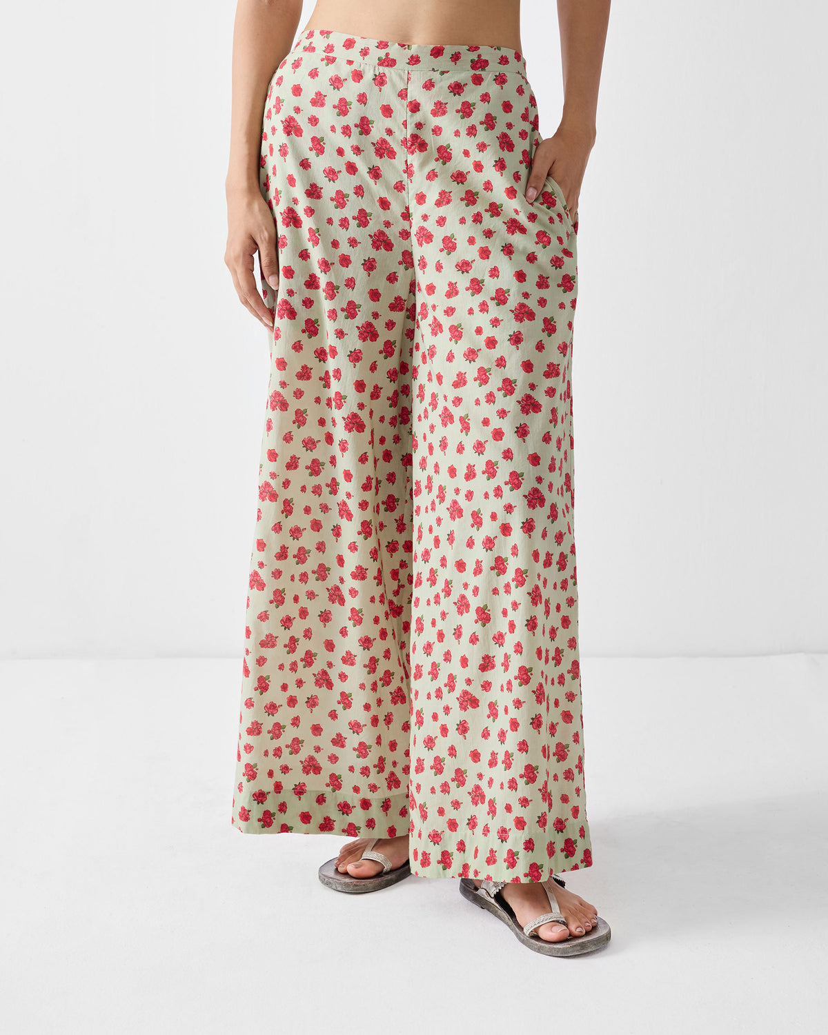 Person wearing mint and watermelon print Basic pyjamas with wide legs.