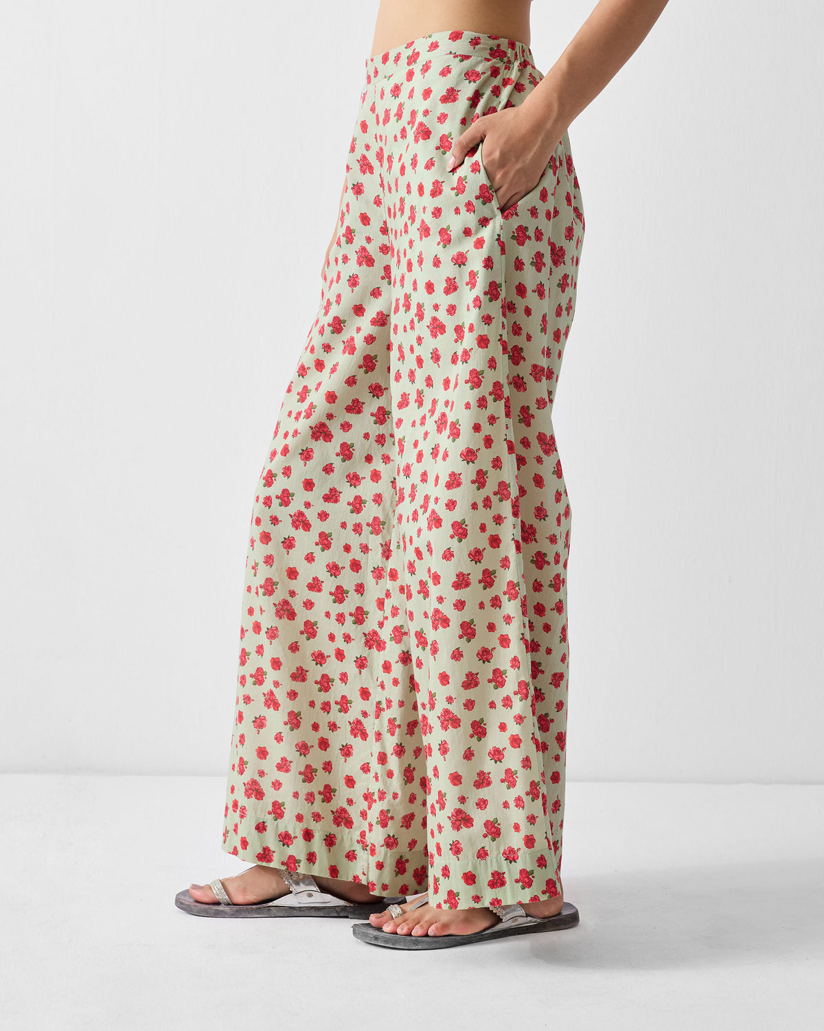 Side view of mint and watermelon print Basic pyjamas with a side pocket.