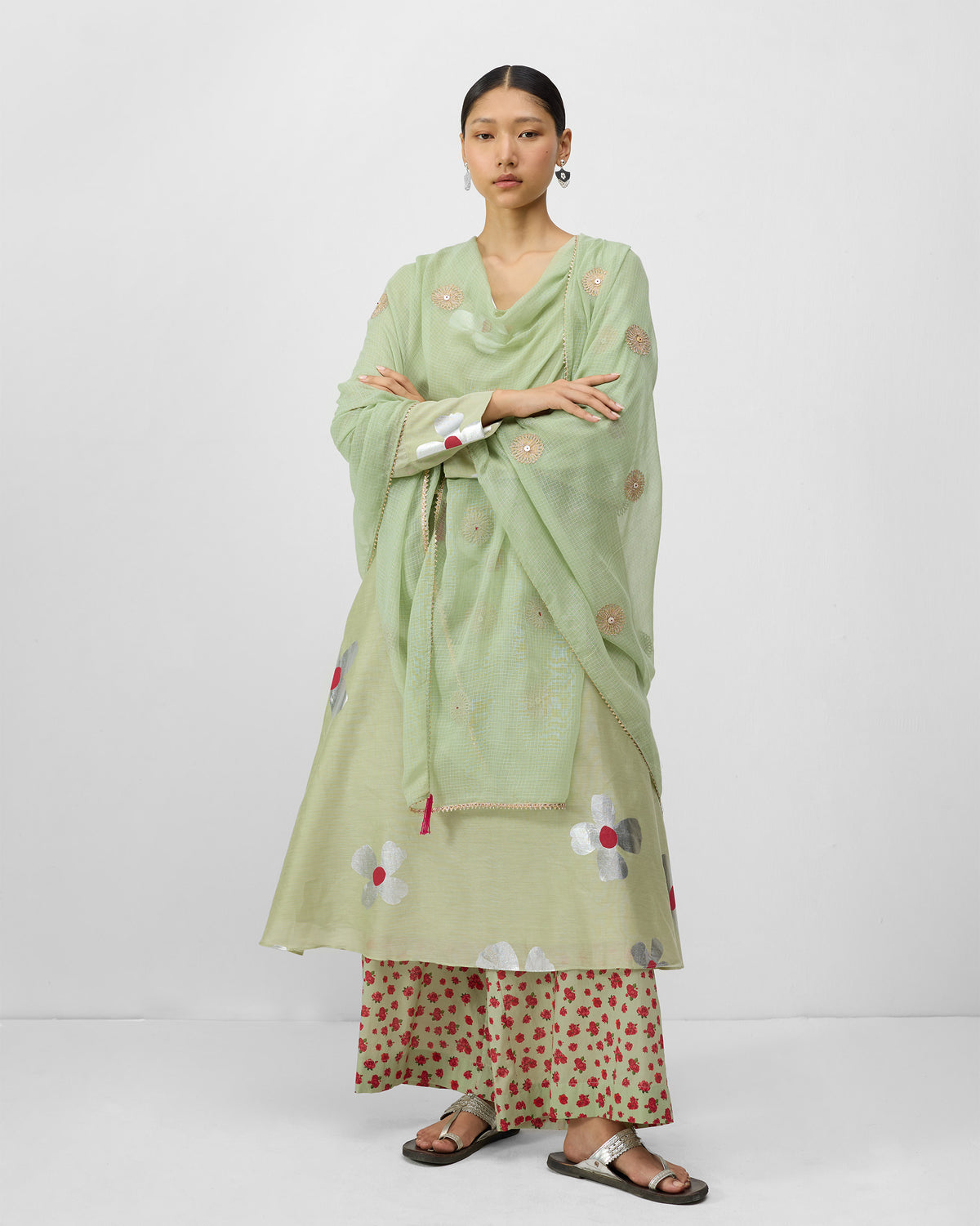 Person wearing mint and watermelon print Basic pyjamas under a sage kurta.