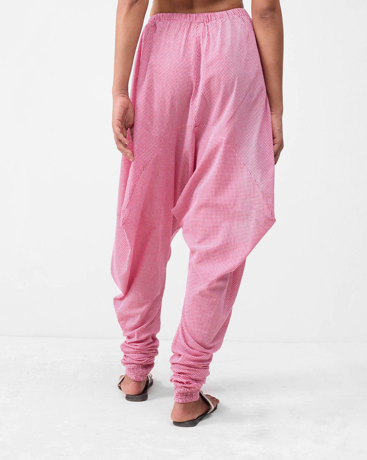 Back of watermelon check Jaisalmer Pants showing the draped seat and gathered ankles.