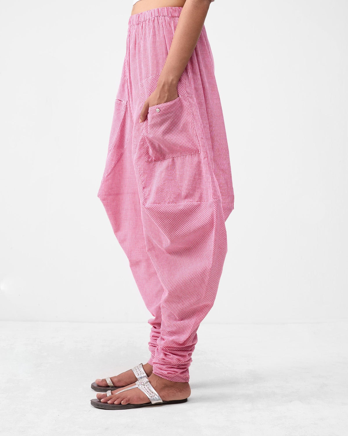 Side view of watermelon check Jaisalmer Pants with a deep side pocket.