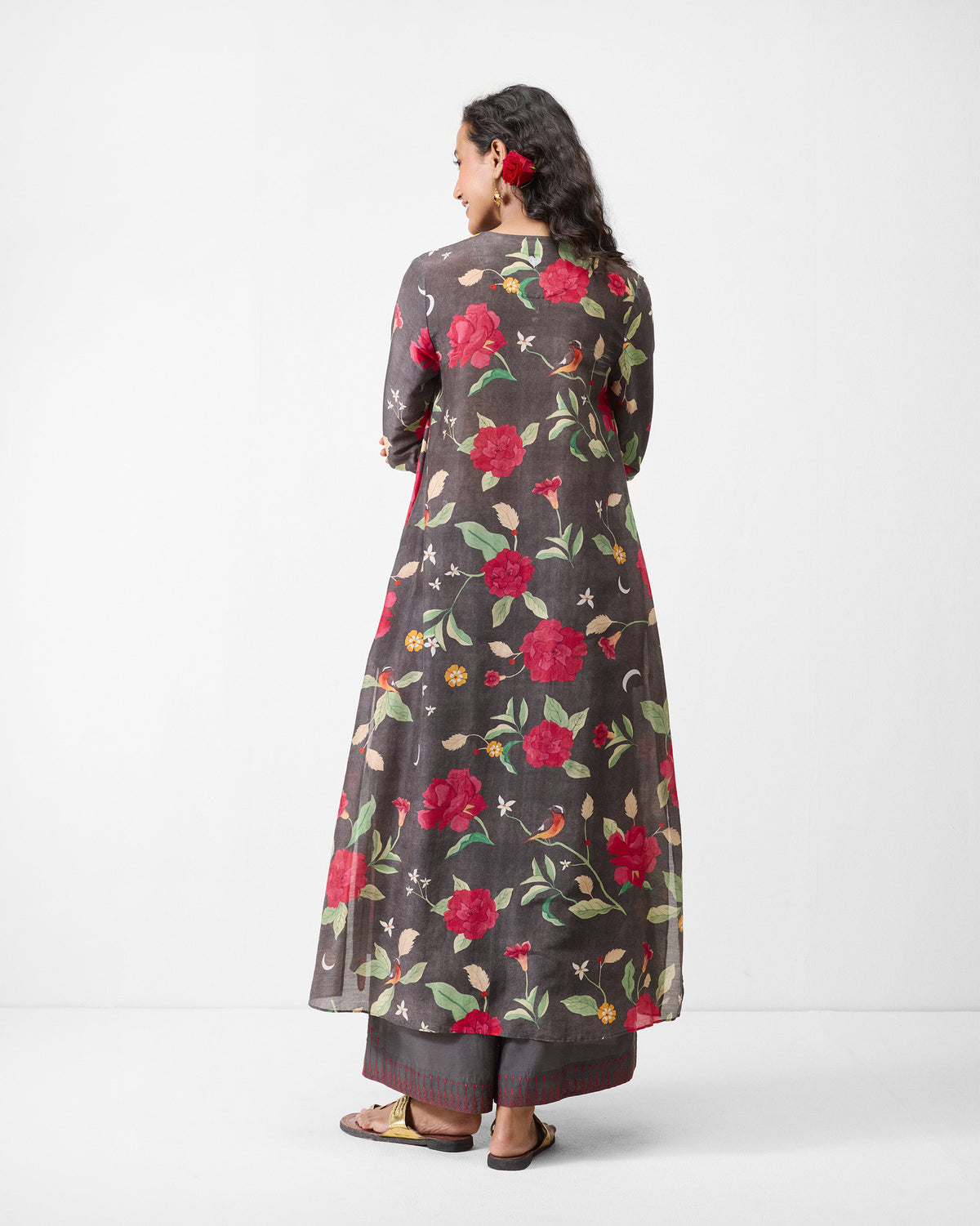 Back of a charcoal kurta with a red floral print.