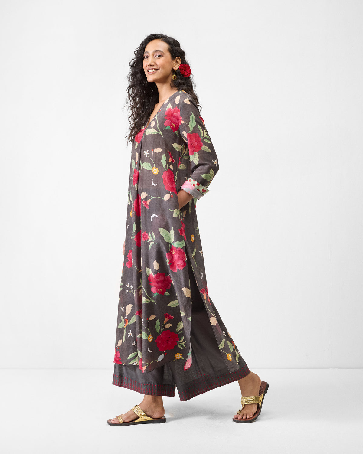 Side view of a charcoal floral kurta worn by a person.