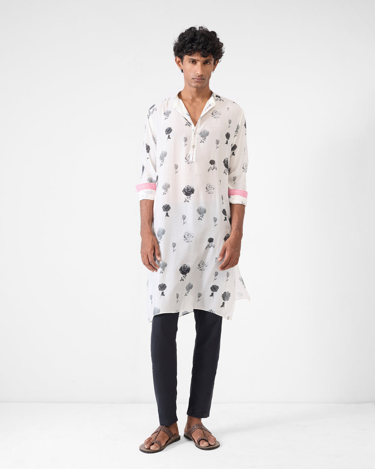 Person wearing a light grey Astral kurta with grey rose print.
