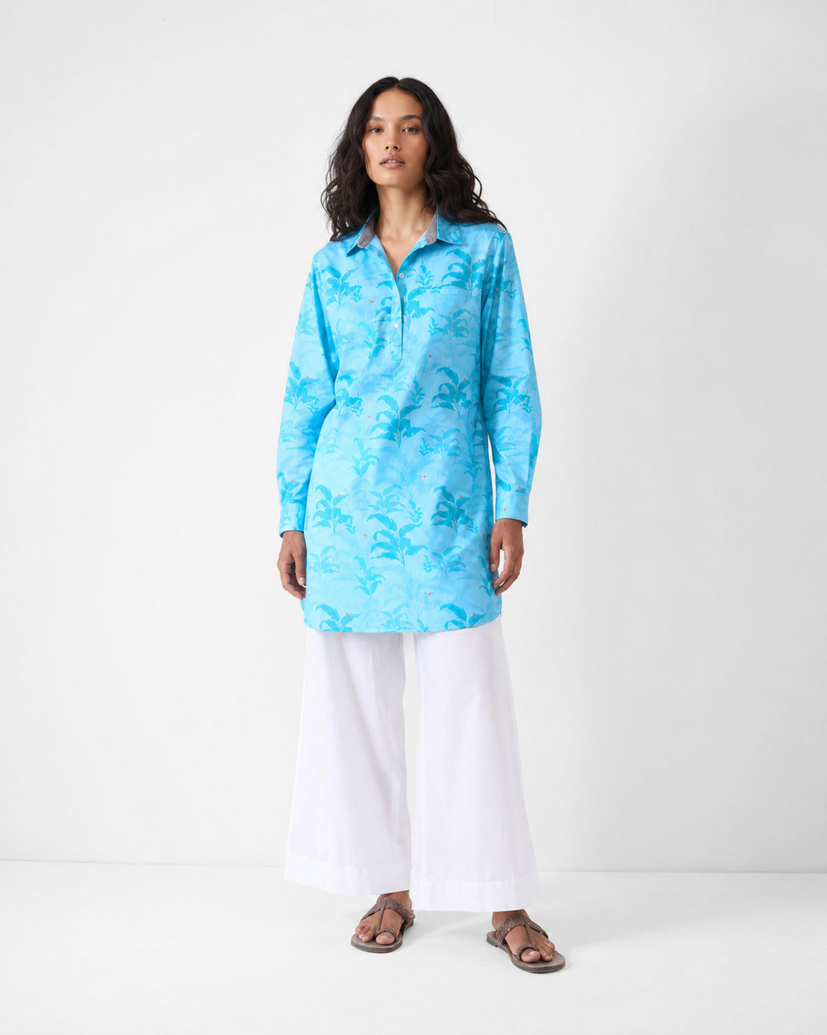 Person wearing a light blue Bouquet Kurta with a tonal leaf print.
