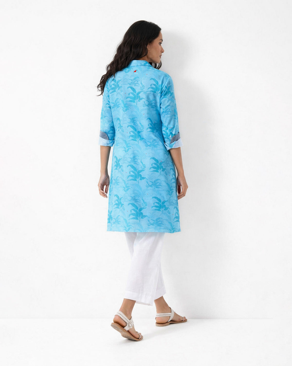 Back of a light blue Bouquet Kurta with a tonal leaf print.