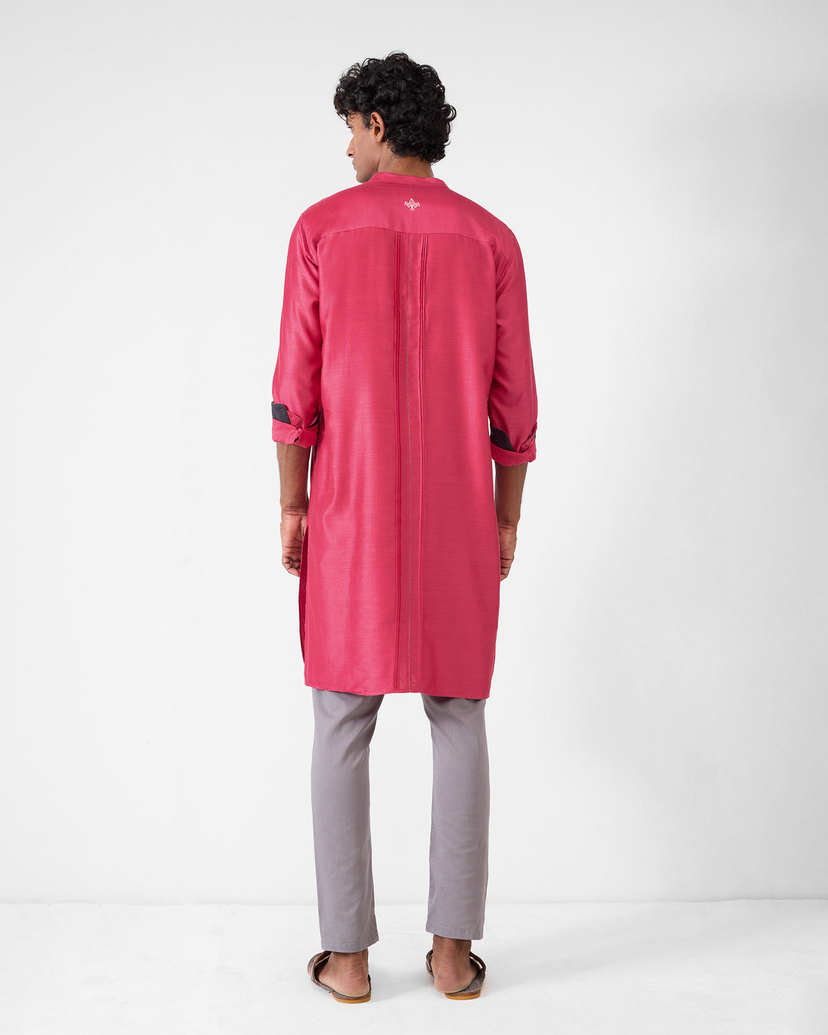 Back of a watermelon Naaz kurta with a white yoke motif.