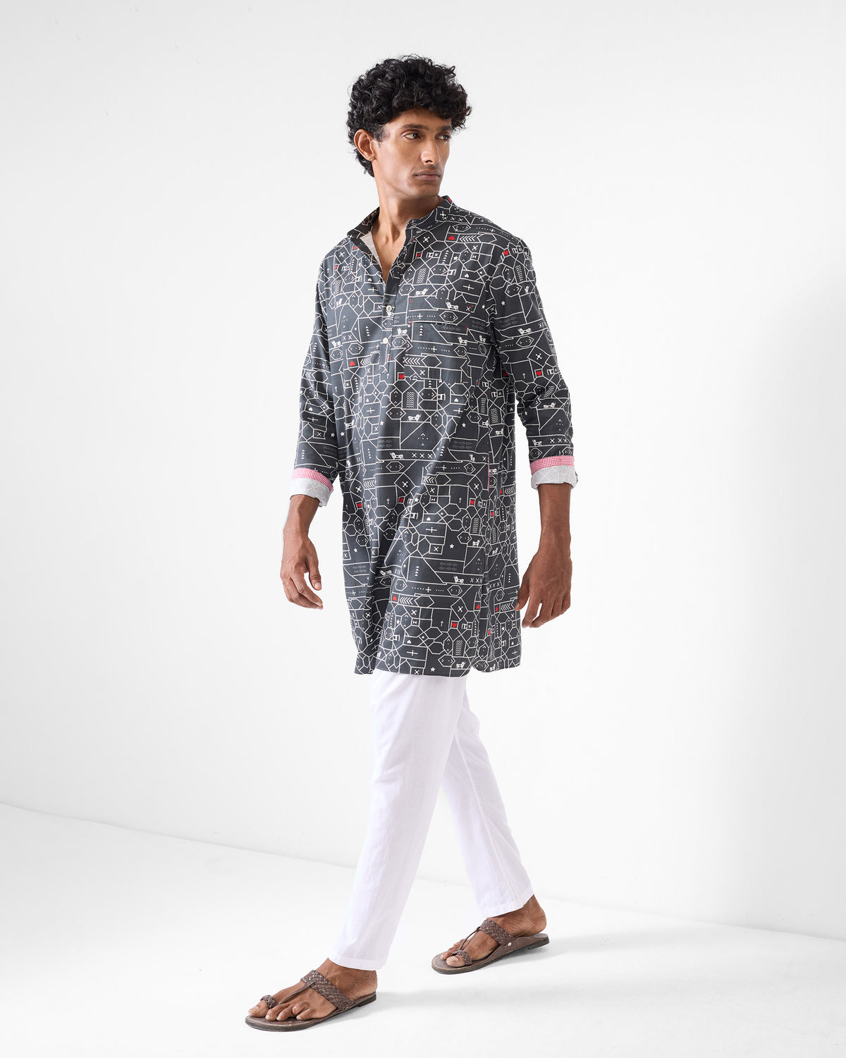 Person wearing a black and grey Galle Kurta with a geometric animal print.