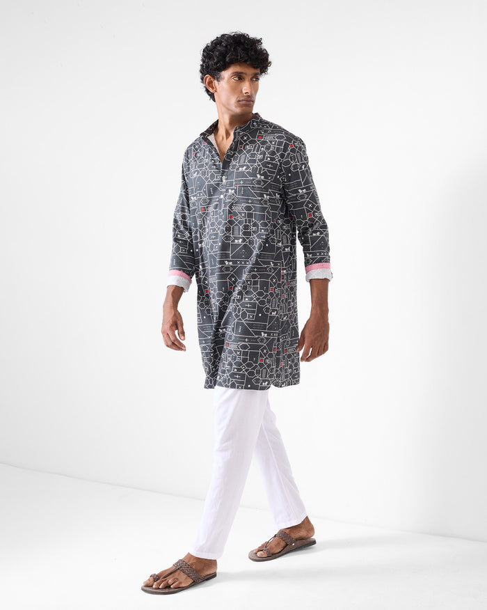 Person wearing a black and grey Galle Kurta with a geometric animal print.